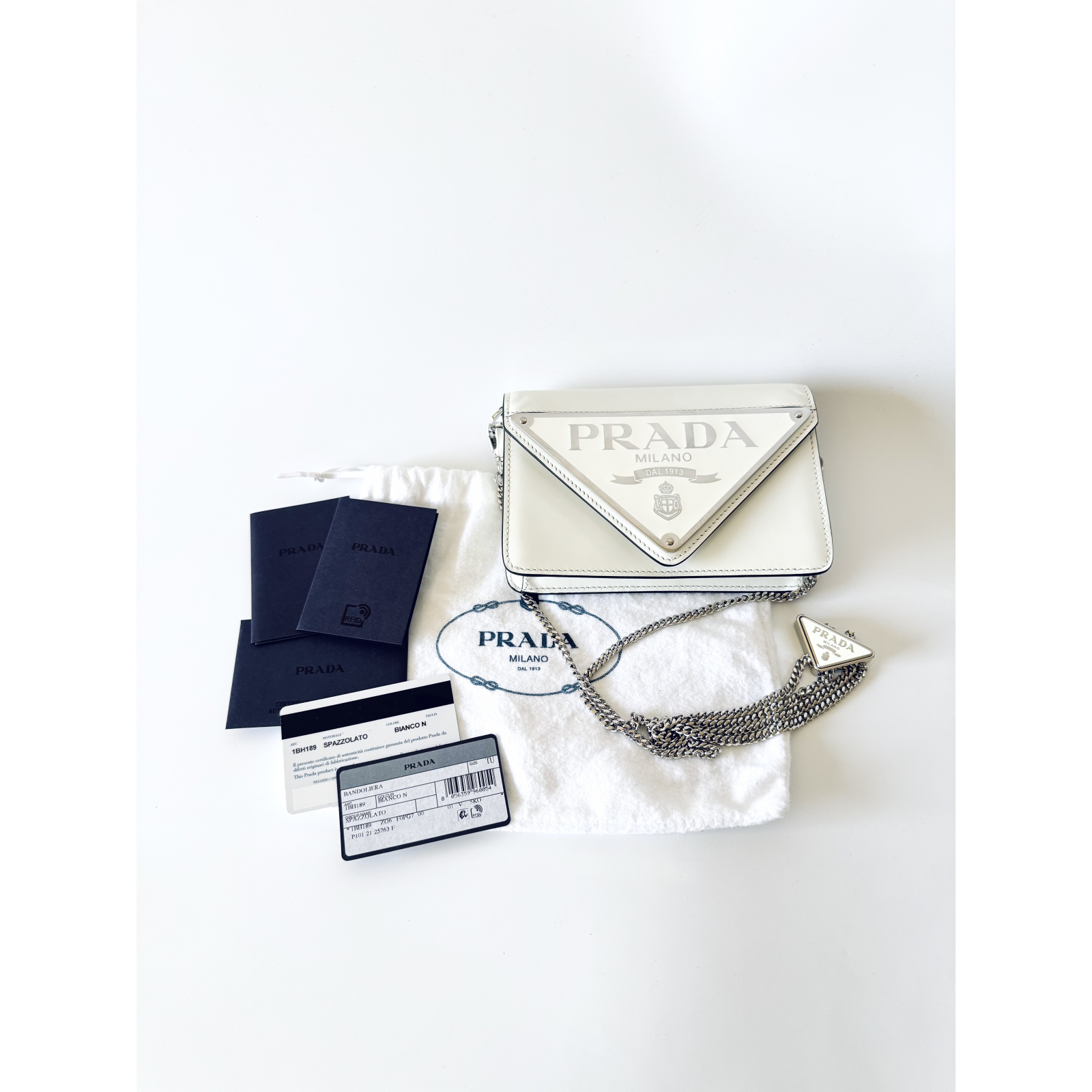 PRADA Mini Leather Crossbody Bag with triangle logo plaque - torebka